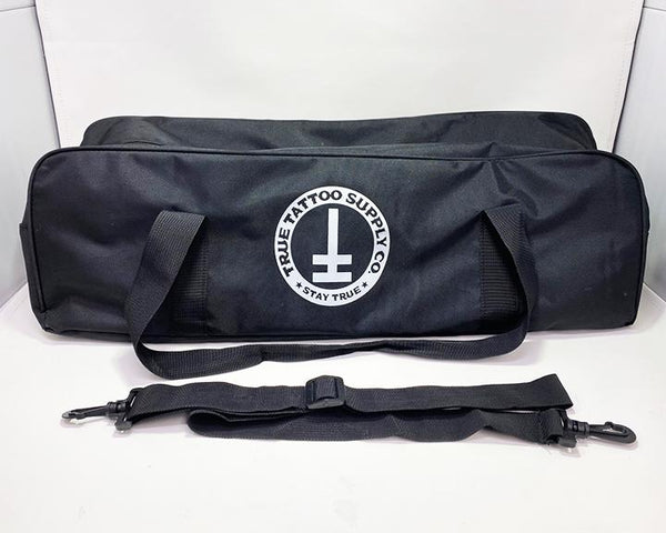 Available at True Tattoo Supply. Armrest Travel Bags for your True Tattoo Armrest! This convenient travel bag is perfect to fit your True Armrest as well as extra parts you may need while traveling! Two Handles for easy carrying and comes along with a strap for shoulder carrier. Bag measures: L - 24" H - 7" W - 7" Made Of: Nylon, Plastic