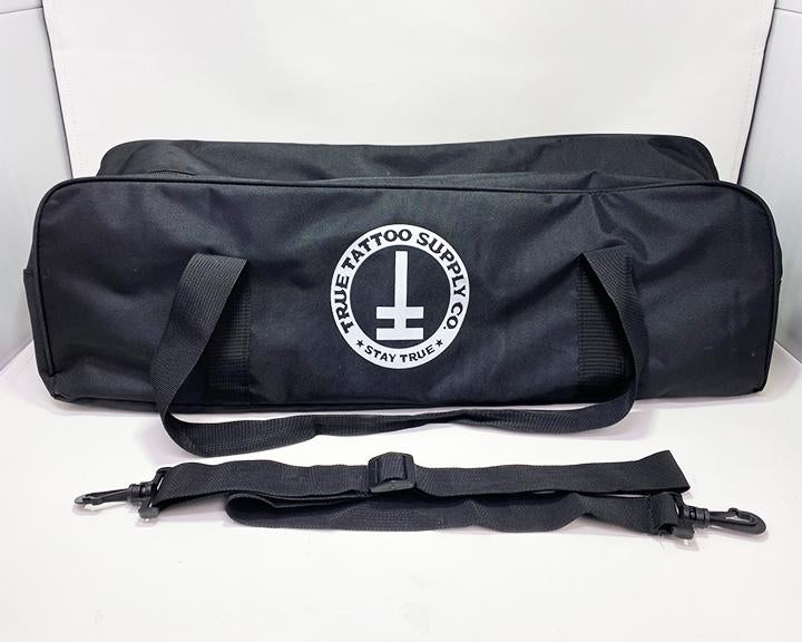 Available at True Tattoo Supply. Armrest Travel Bags for your True Tattoo Armrest! This convenient travel bag is perfect to fit your True Armrest as well as extra parts you may need while traveling! Two Handles for easy carrying and comes along with a strap for shoulder carrier. Bag measures: L - 24" H - 7" W - 7" Made Of: Nylon, Plastic