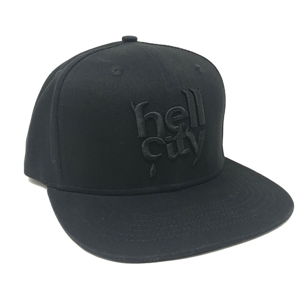 Available at True Tattoo Supply. The all NEW Hell City Black Logo Hat is a Hell City legendary hat! Super cozy Flat Rim, Snap Back Tattoo Hat from Hell! Grab yours today! One size fits all! All Black Hat, Black threading, Black snapback.