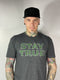 Available at True Tattoo Supply. Stay true! Large print on the front states the obvious, STAY TRUE, small True Tattoo logo on the back, Dark heather gray shirt with distressed print.  Available in S-XXL