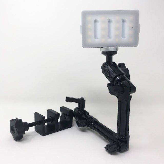 Available at True Tattoo Supply. The Tattoo Arm Rest Light Extension (light sold separately) gives the tattoo artist the convenience of a sturdy, cordless light extension while working. Comes with a 360° Multi Joint, Adjustable, Rotating, Secure, Locking extension. Fits most armrests, flat-edged tables, desks, lamps or work stations.  ** LIGHTS SOLD SEPARATELY - CLICK HERE **  Extension Kit Includes (without light): 3 - arms 2 - elbow clamps 1-  base clamp 1 - light screw 1 - Light / Phone Clamp